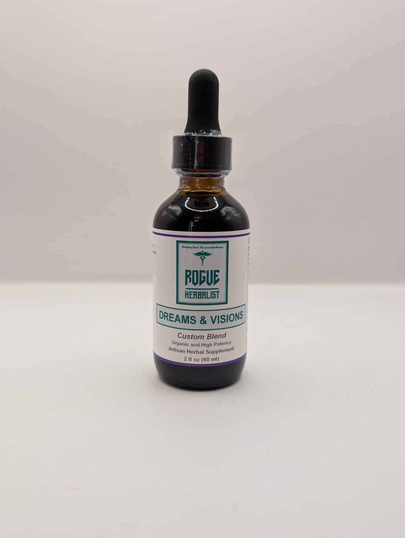 Glass bottle of Rogue Herbalist Dreams & Visions Tincture 2oz with dropper, featuring mugwort, blue lotus, damiana, lavender, and blue vervain.